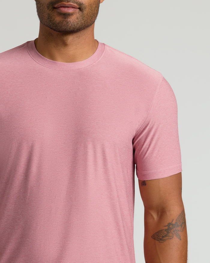 Quartz Rose Active Crew Neck Tee showcasing tattooed arm and heathered texture.