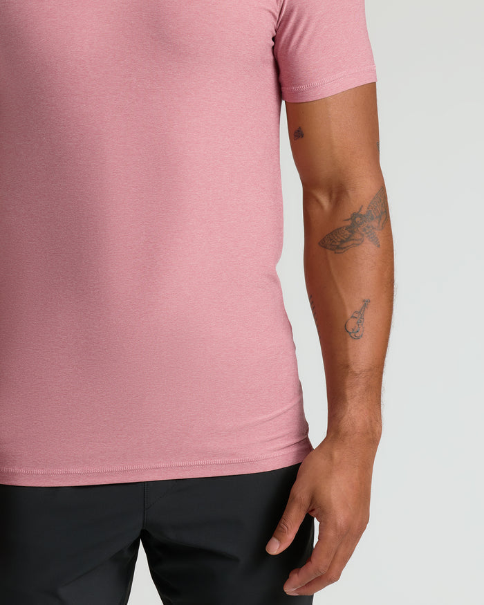 Quartz Rose Active Polo 2.0 showcasing tattoos and soft fabric.