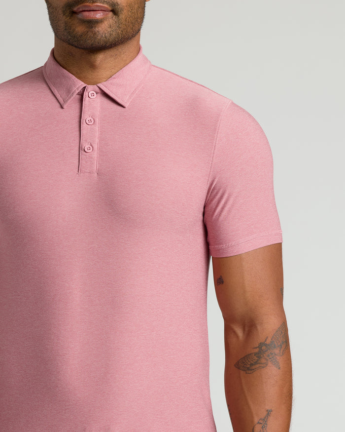 Man wearing Quartz Rose Active Polo 2.0 with tattoos visible.