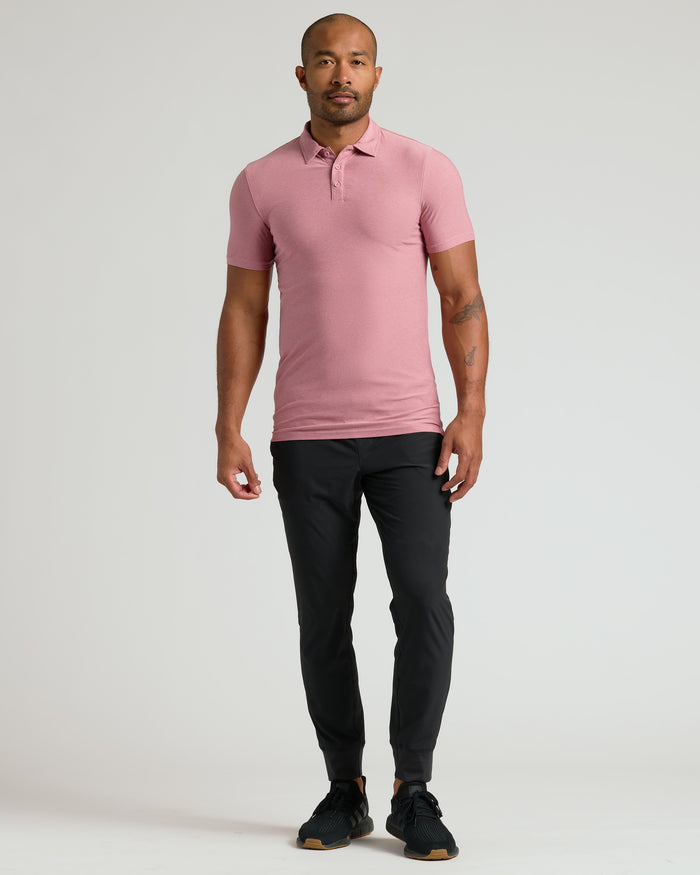 Man wearing Quartz Rose Active Polo 2.0 with jogger pants.