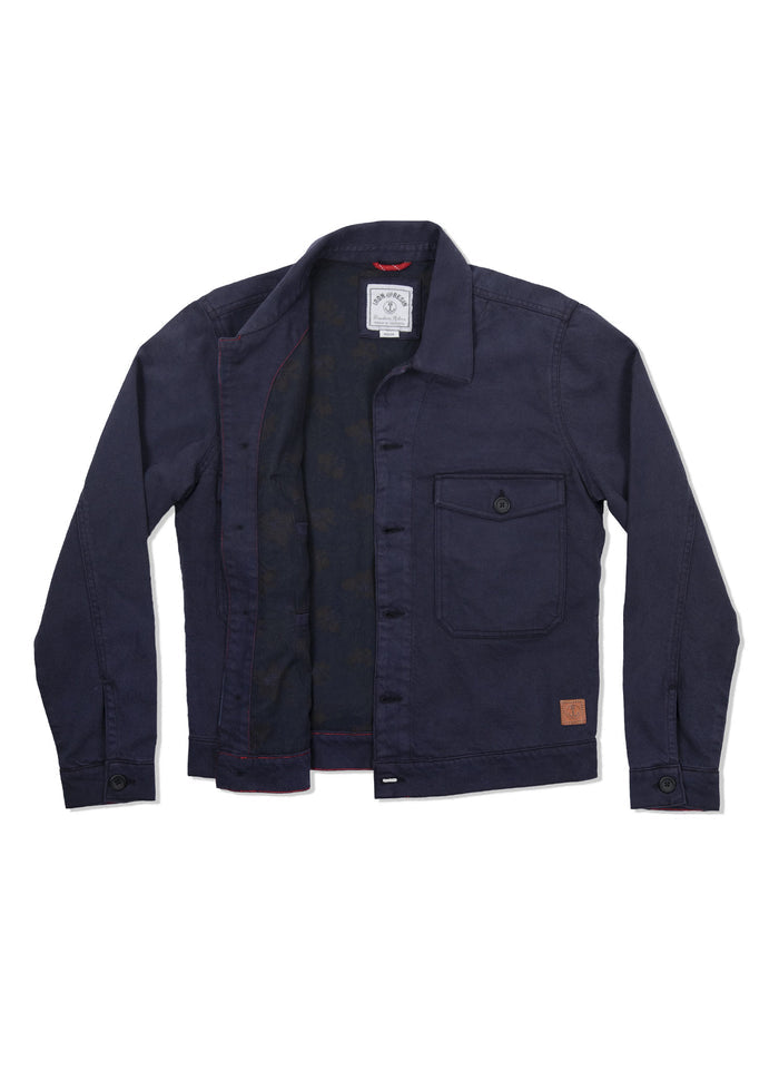 Navy blue jacket with open front, single chest pocket, and visible inner label. Simple design with buttoned cuffs and collar.
