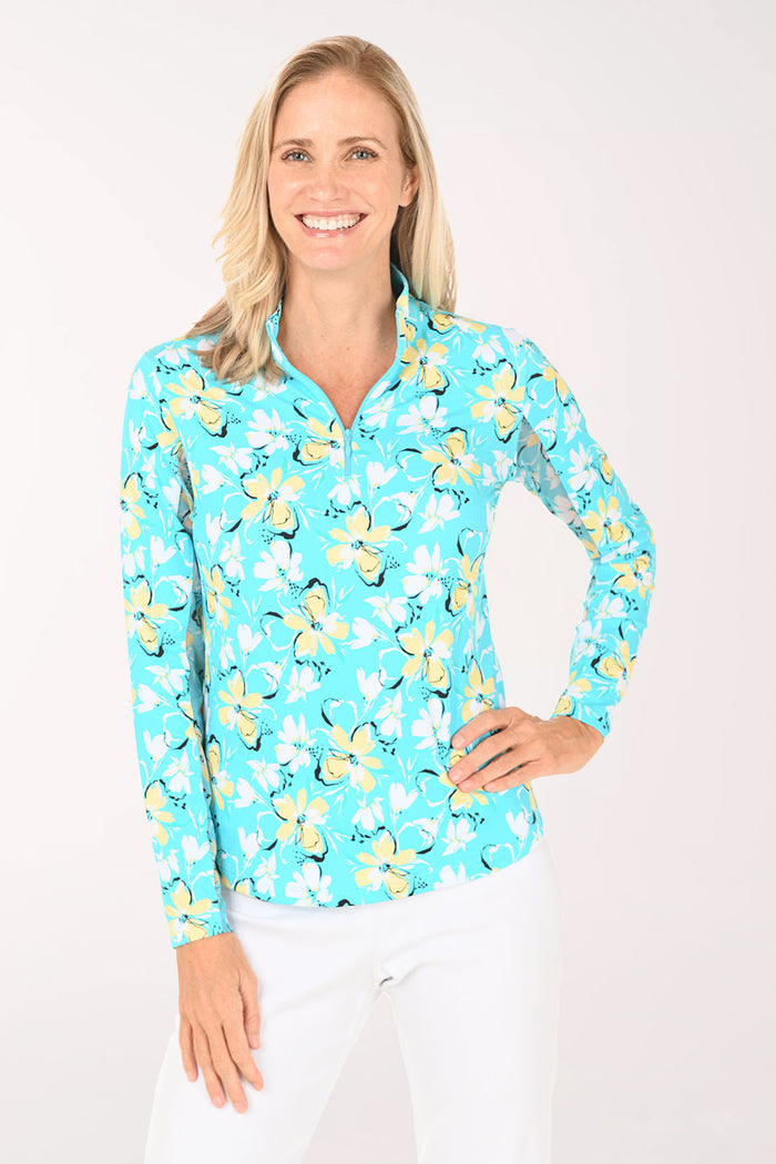 Woman wearing a blue floral patterned shirt on a white background