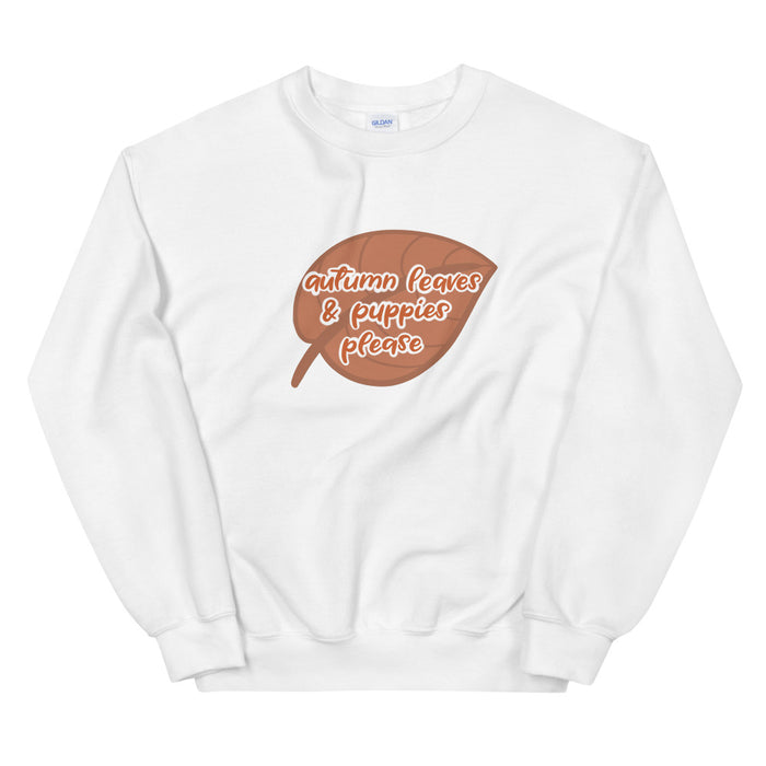 The Sassy Woof Sweatshirt - Autumn Leaves & Puppies Please is a cozy white top with a brown leaf graphic and playful text, perfect for puppy cuddles and fall activities.