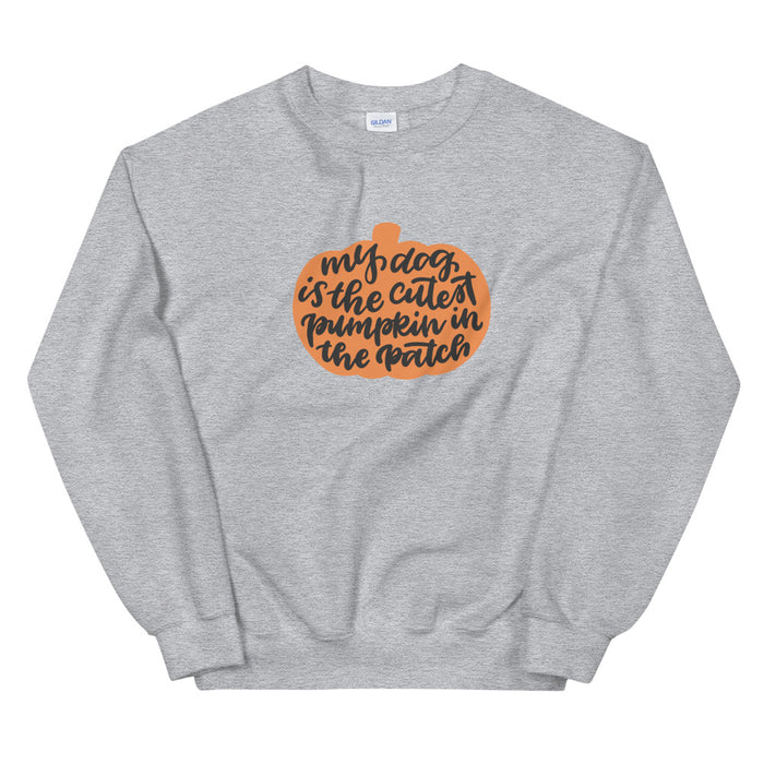 Stay cozy in the Sassy Woof "My Dog is the Cutest Pumpkin in the Patch" sweatshirt—light gray, unisex, with a playful orange pumpkin graphic and cute handwritten text. The perfect fall pick for dog lovers!.