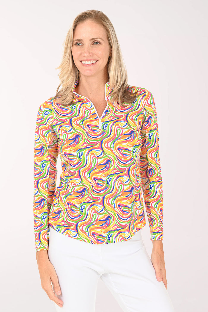 Woman wearing a colorful patterned shirt on a white background