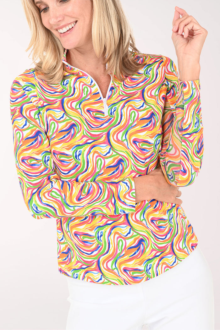 Woman wearing a colorful patterned shirt on a white background