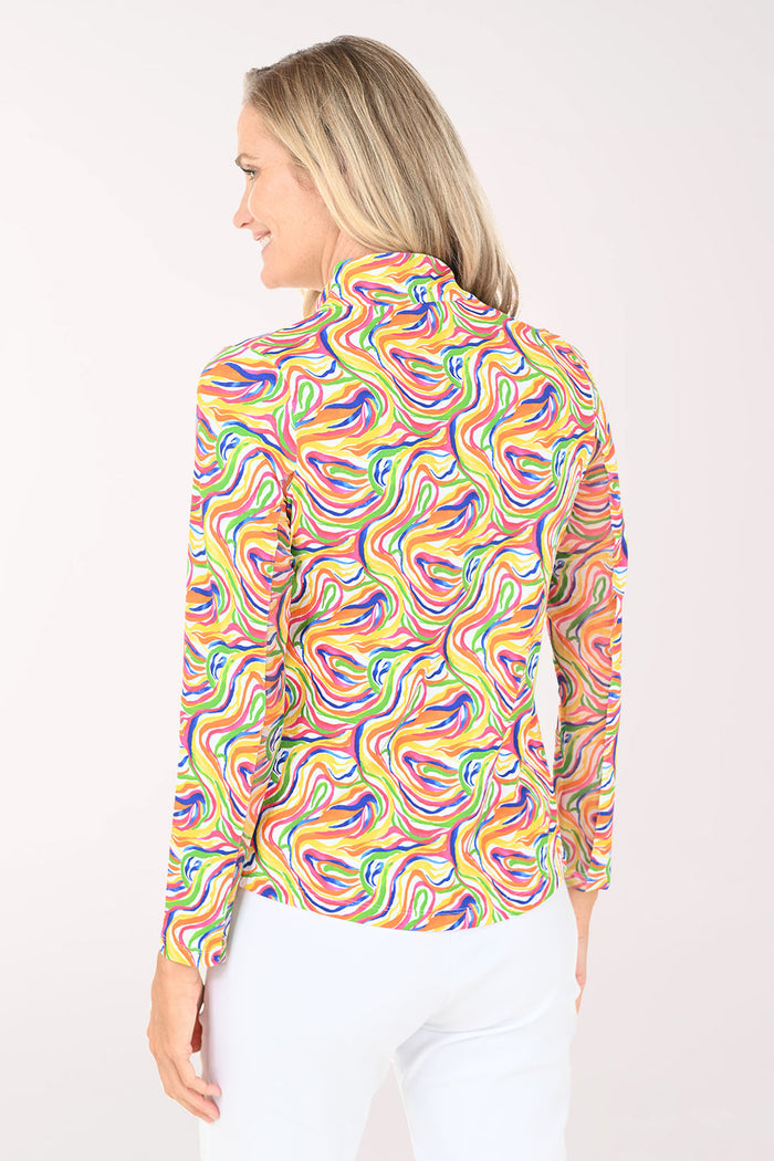 Woman wearing a colorful patterned shirt on a white background