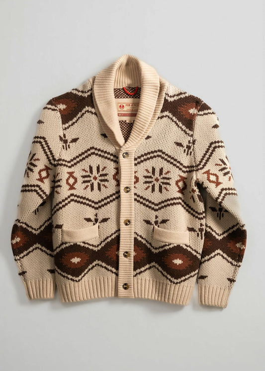 Beige cardigan with a brown geometric pattern and shawl collar, featuring buttons and pockets, displayed on a plain background.